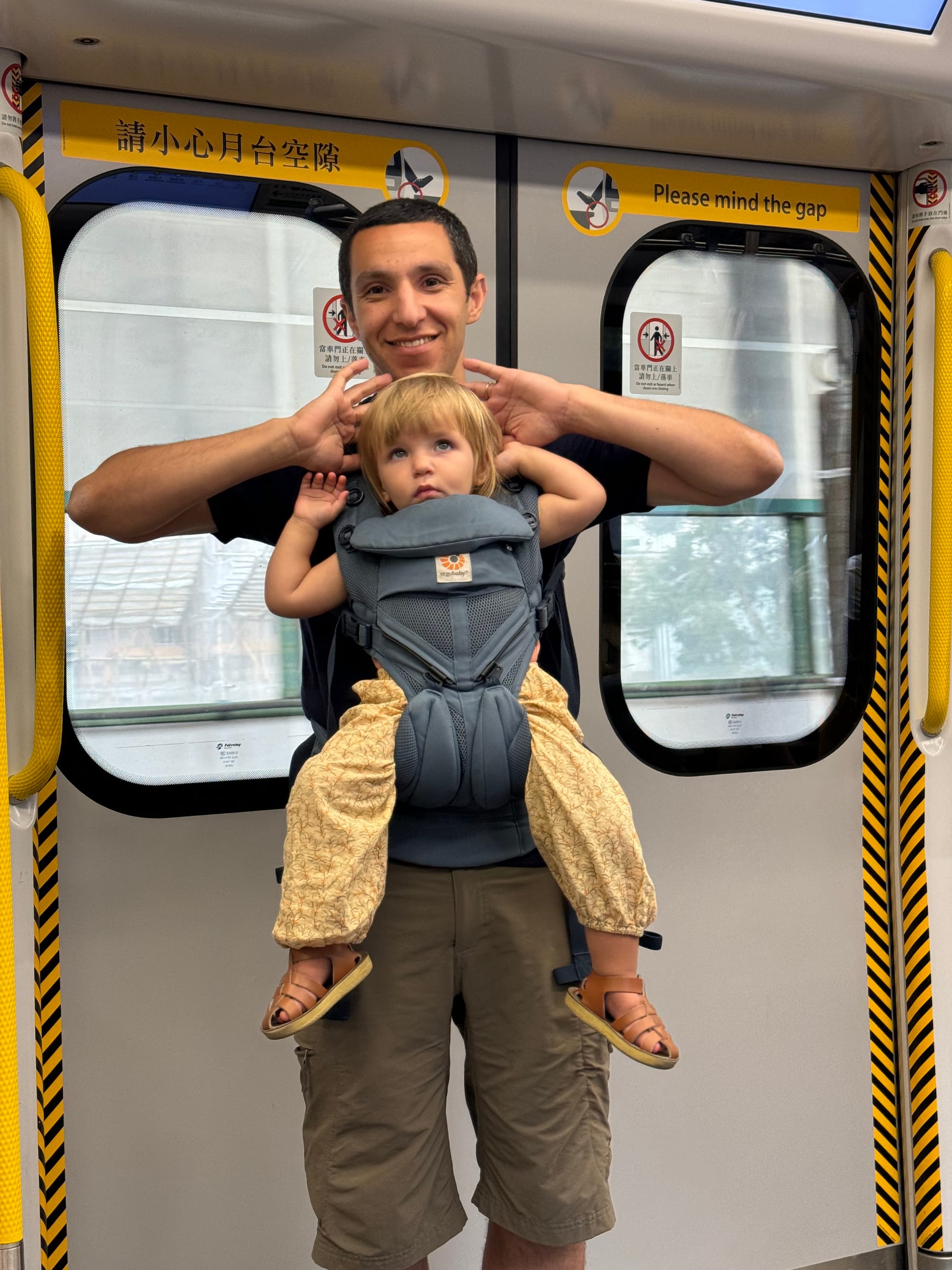 Riding a metro with a baby in the carrier